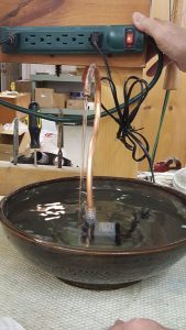 Finishing and placing antimicrobrial copper tube in cat water fountain.