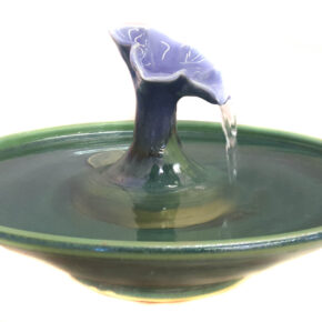 A gorgeous cat fountain in a Petunia design with a Lavender Blue blossom and a Deep Spruce fountain bowl. Water fills the blossom and streams into the bowl. Excellent for long hair cats. * 3.25 inches high by 12